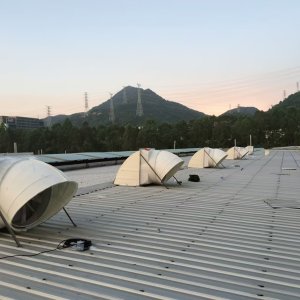 Rooftop exhaust fan installed on a farm building
