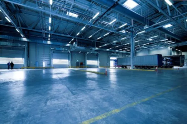 Large empty warehouse hall with a truck